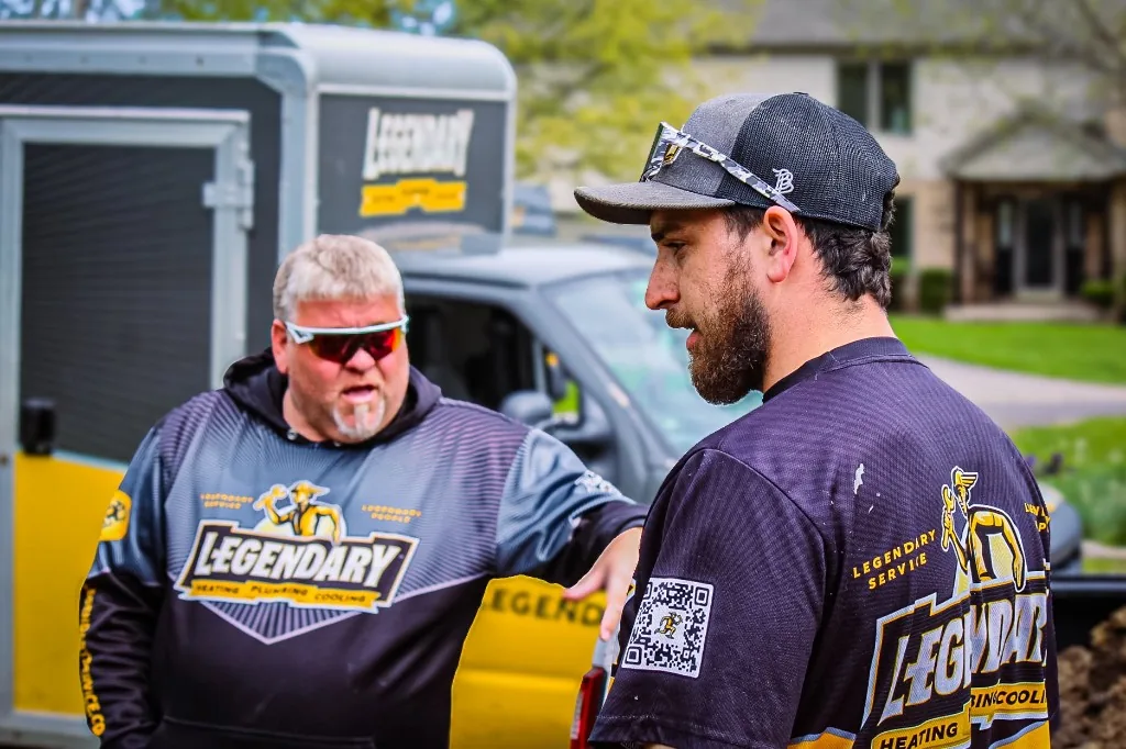 Legendary Service technician walking a homeowner through options during a service visit